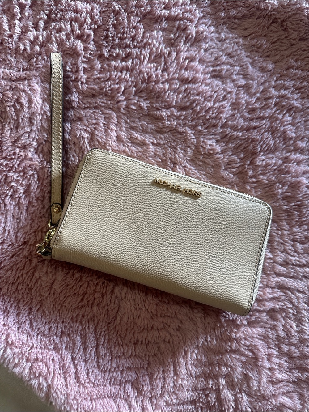 MK wristlet in light tan/ Beige
